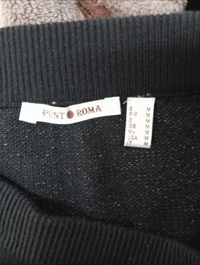 Falda de punto negra con detalles plateados