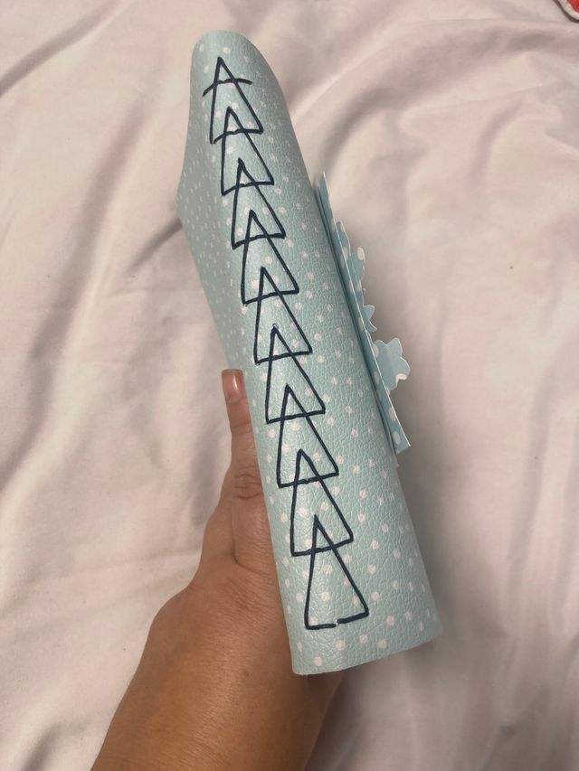 Álbum de fotos cosido con mariposa