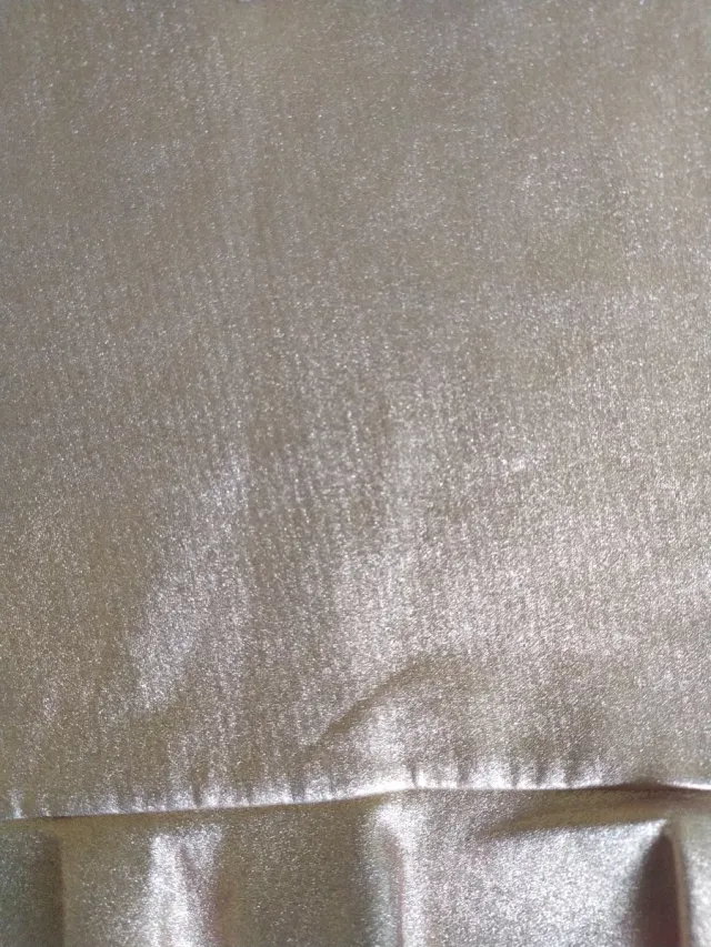 Top brillo rosa con volantes