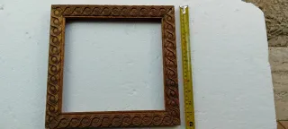 Cornice antica in legno intagliato