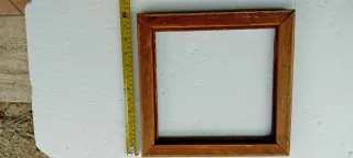 Cornice antica in legno intagliato