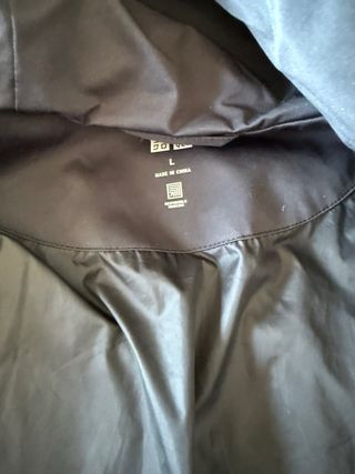 Abrigo plumífero Uniqlo gris