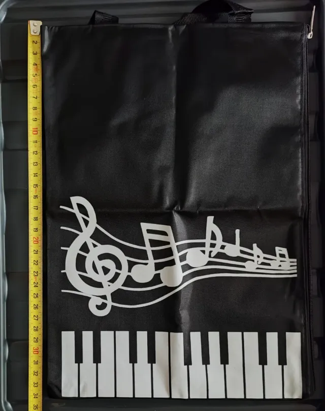 Bolsa de música con diseño de piano y pentagrama