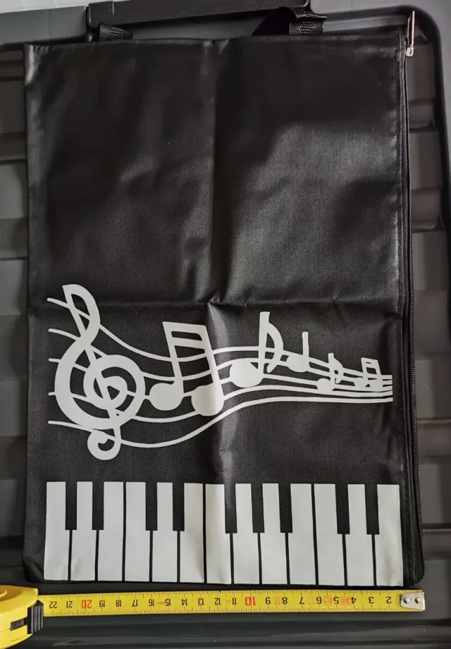 Bolsa de música con diseño de piano y pentagrama