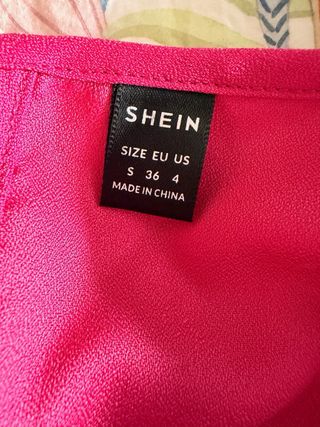 Blusa fucsia manga abullonada