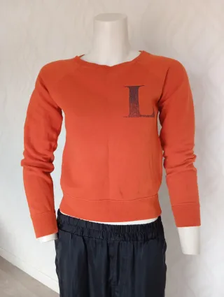 Sudadera Zara naranja con letra L