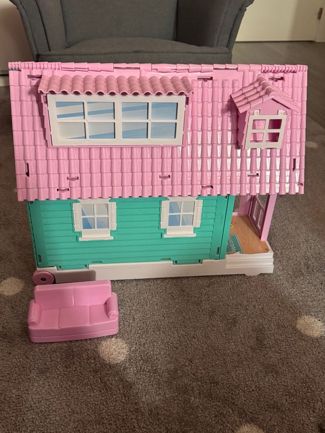 Casa de muñecas rosa y turquesa
