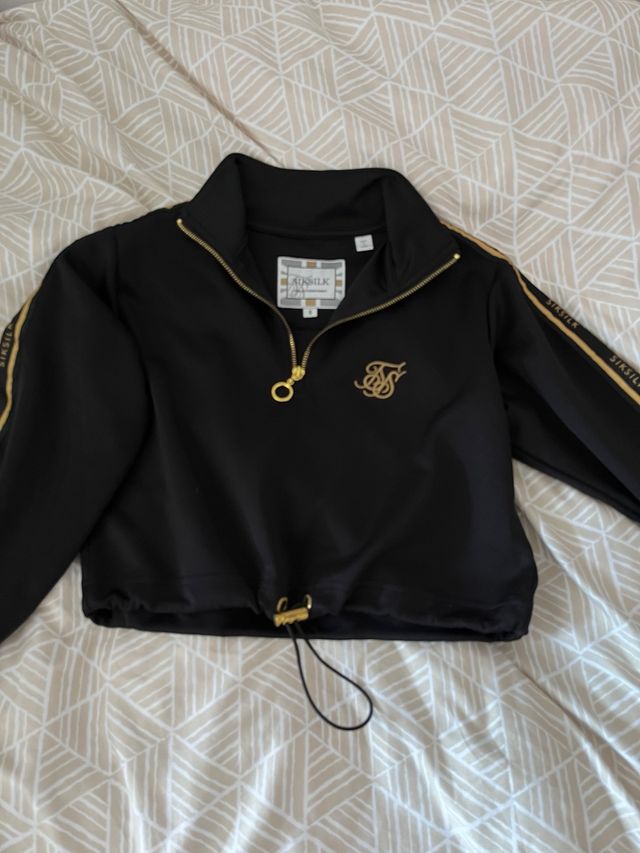 Jersey corto SikSilk negro y dorado Talla S