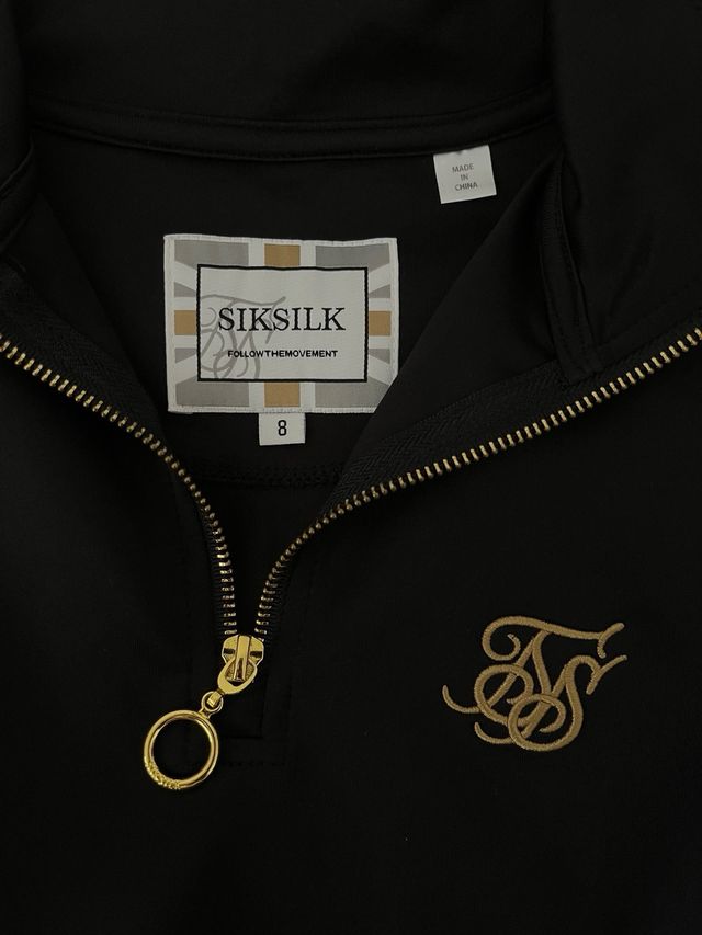 Jersey corto SikSilk negro y dorado Talla S