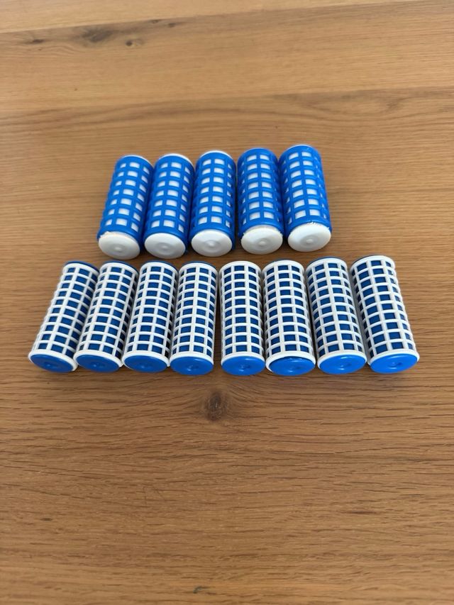 Rulos de agua caliente con neceser dorado