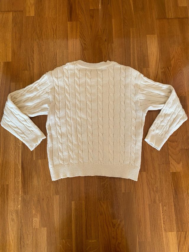 Jersey de punto trenzado color crema