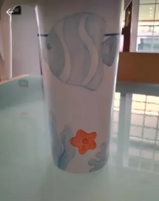 Caraffa Thun con pesci e conchiglie