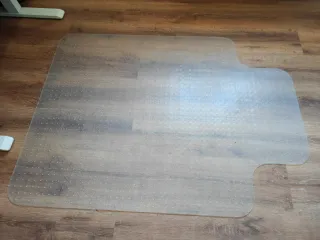 Alfombra protectora transparente para silla