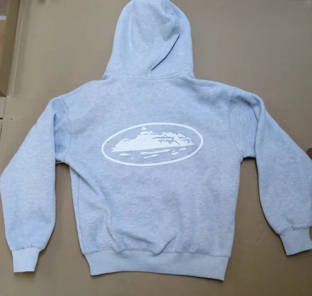 Sudadera Corteiz gris con cremallera y capucha