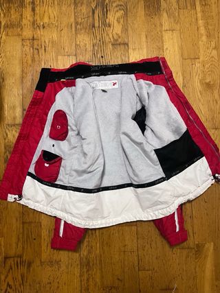 Giacca per la neve rossa e bianca