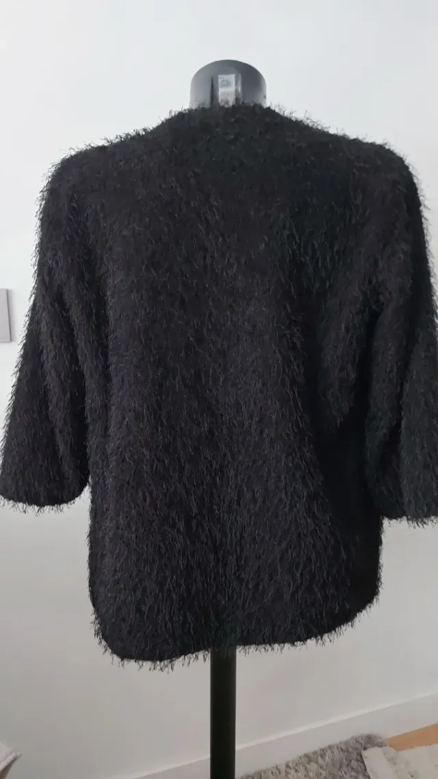 Chaqueta de hilos con brillo negra