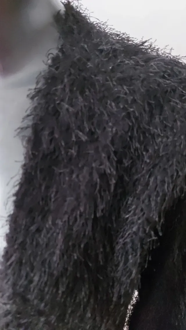 Chaqueta de hilos con brillo negra