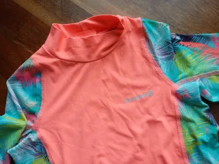 Licra Olaian Coral y Palmeras Talla 10-12 años