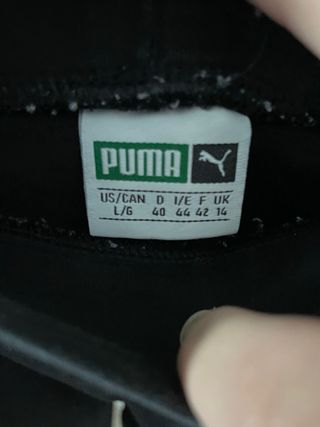 Leggings Puma negros con banda lateral blanca