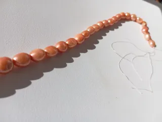 Hilo de perlas naturales naranja y rosa