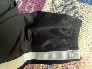 Pantalón chándal Nike negro con banda blanca