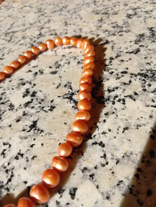 Hilo de perlas naturales naranja y rosa