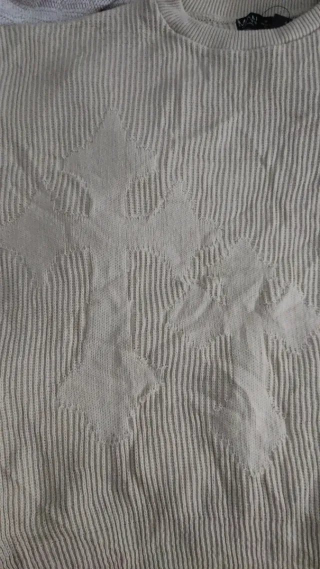 Jersey de punto beige con diseño