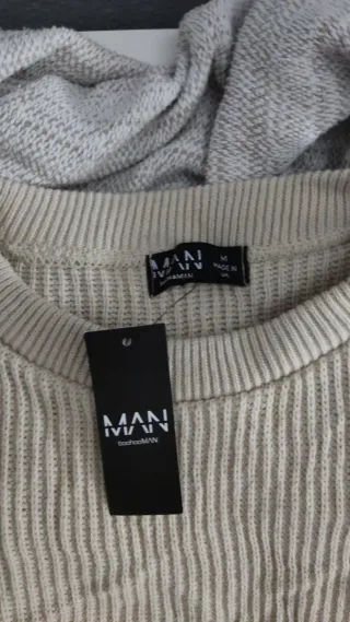 Jersey de punto beige con diseño