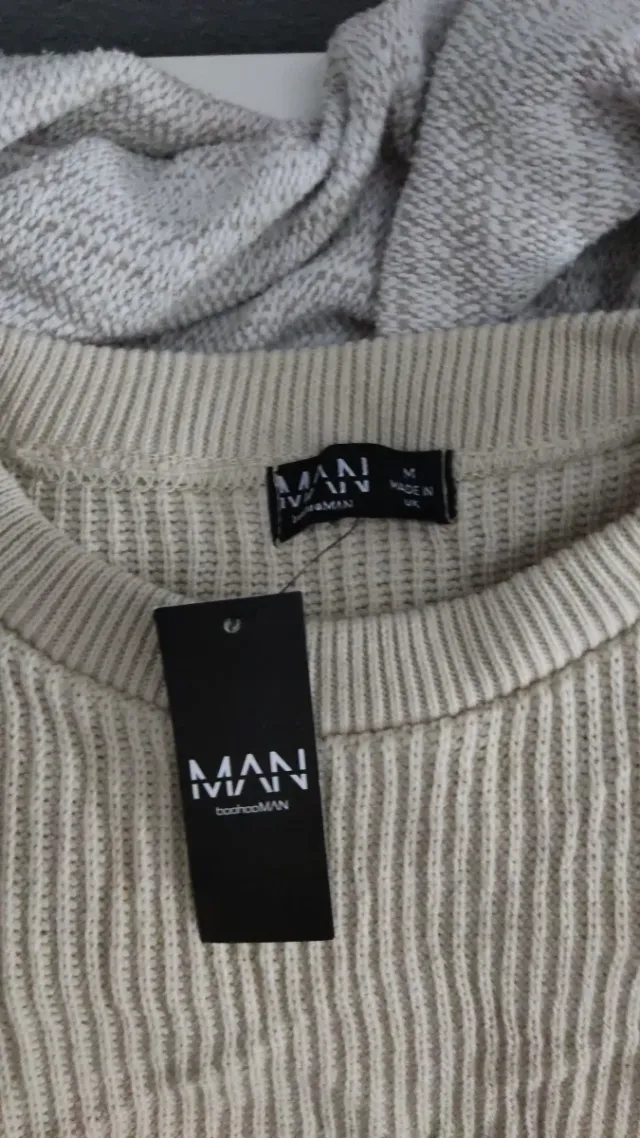 Jersey de punto beige con diseño