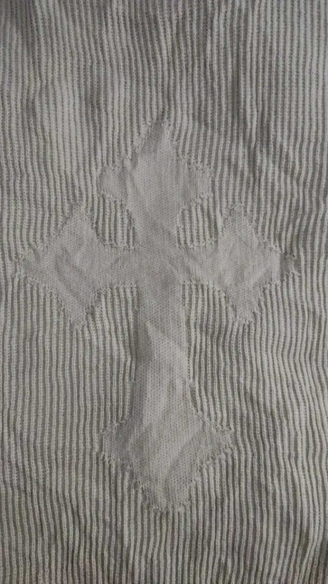 Jersey de punto beige con diseño