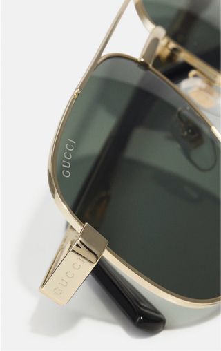 Gafas de sol Gucci unisex doradas y verdes