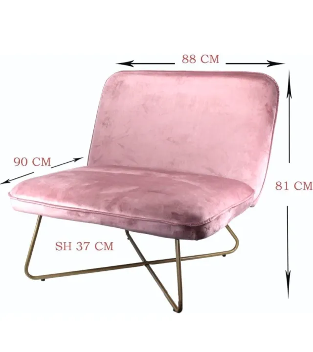 Sillón rosa de terciopelo con patas doradas. Nuevo