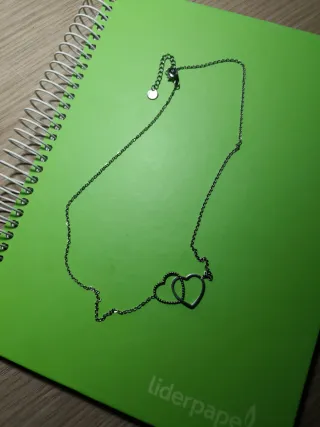 Colgante dos corazones plateado acero