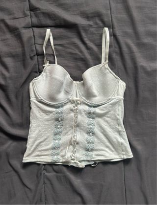 Corsé azul con cordones y lunares