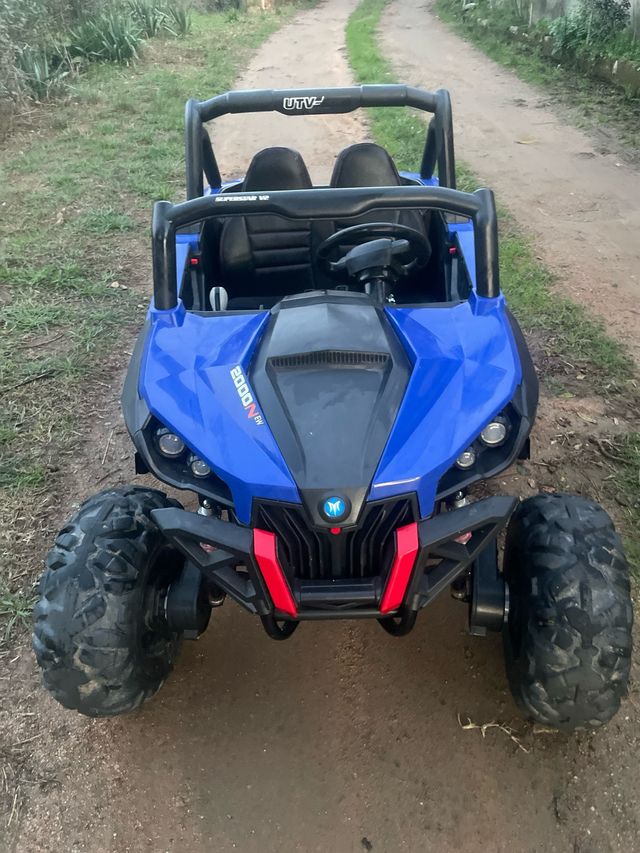 Buggy eléctrico azul UTV-MX 12V de dos plazas