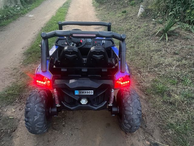 Buggy eléctrico azul UTV-MX 12V de dos plazas