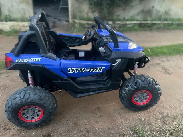 Buggy eléctrico azul UTV-MX 12V de dos plazas