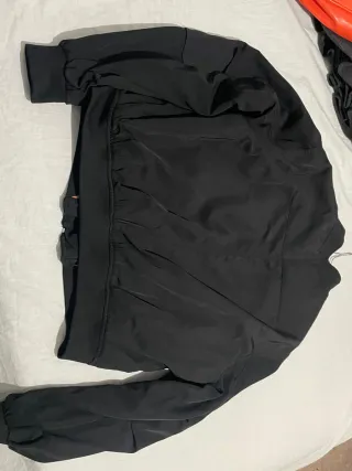 Chaqueta bomber negra con forro naranja