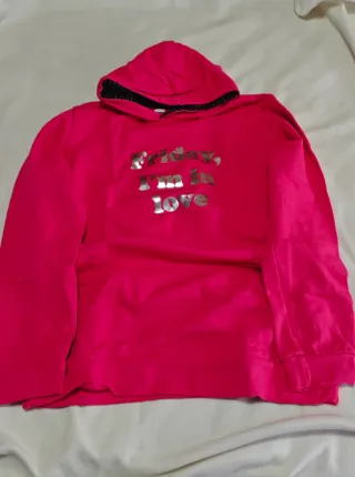 Sudadera rosa con capucha y mensaje