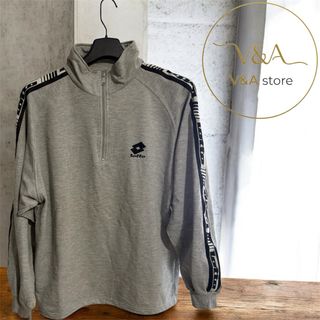 Sudadera Lotto gris con cremallera y logo