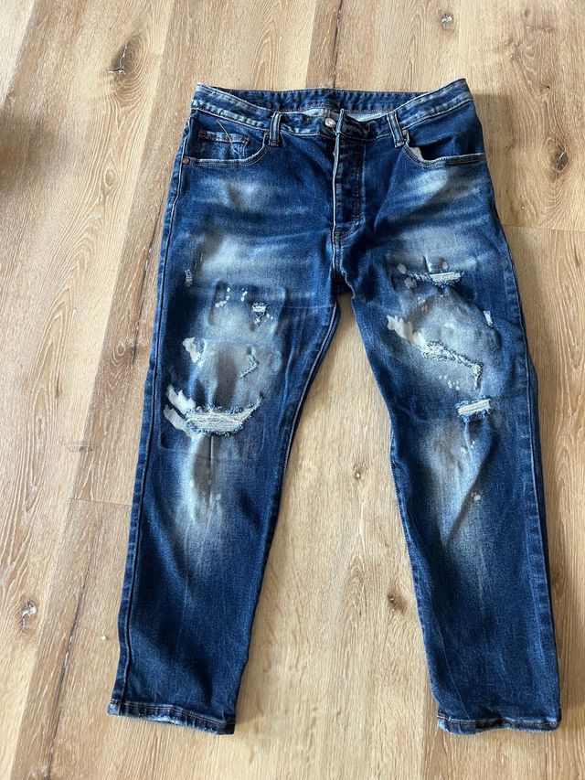 Jeans uomo blu strappati