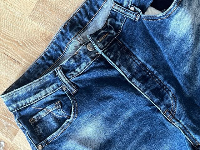 Jeans uomo blu strappati