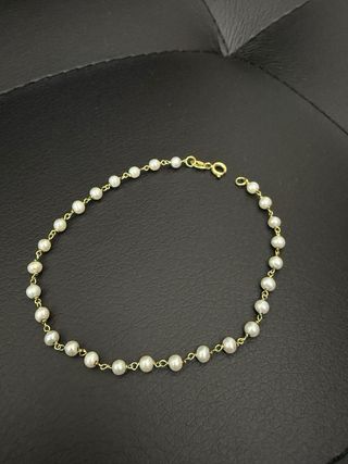 Pulsera de oro y perlas blancas