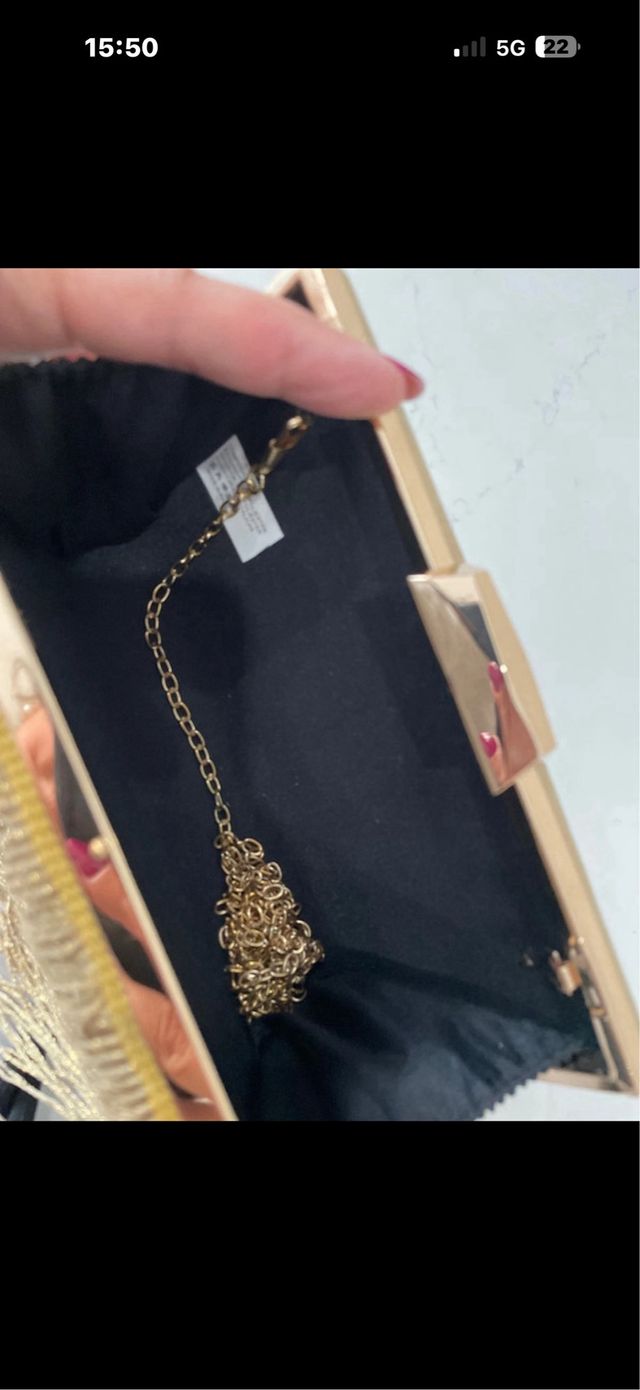 Bolso de fiesta dorado con flecos