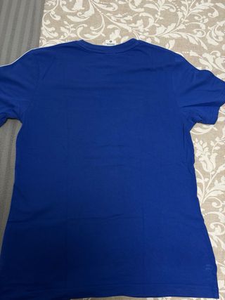 Camiseta Nike azul con logo