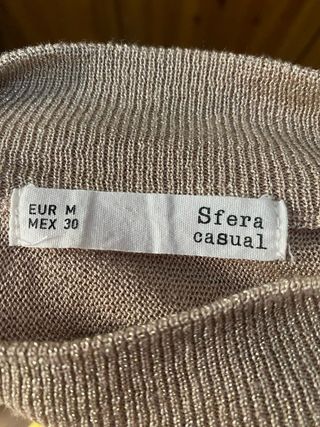 Jersey dorado cuello alto mujer