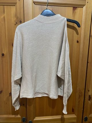 Jersey dorado cuello alto mujer