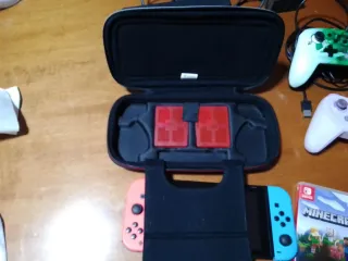 Nintendo Switch con juegos y mandos ,funda y caja