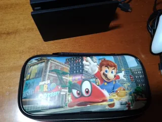 Nintendo Switch con juegos y mandos ,funda y caja