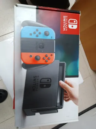 Nintendo Switch con juegos y mandos ,funda y caja